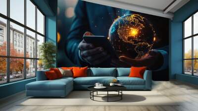 Close up of businessman hand holding cellphone with creative glowing globe hologram on dark background. Technology, metaverse and digital map concept Wall mural