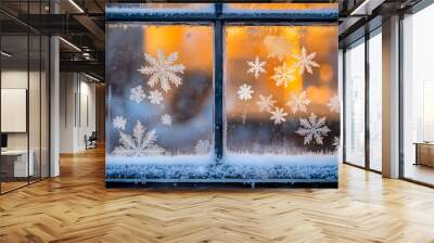 A detailed image of a frosty window with snowflakes and warm light shining from inside the house Wall mural