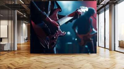 a live band playing at a concert, with focus on the guitarist’s hands strumming the strings Wall mural