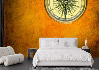 Golden compass on an old textured surface Wall mural