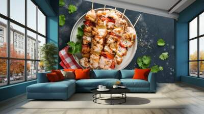 Chicken shish kebab or skewers kebab in a ceramic plate, spices, cilantro herbs and vegetables on white table background. Barbecue Raw ingredients for goulash or shish kebab. Top view. Free copy space Wall mural