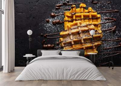 Pumpkin waffles with chocolate and sugar powder on dark old background. Top view Wall mural