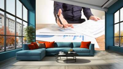 business man analyzing graph and chart document report Wall mural