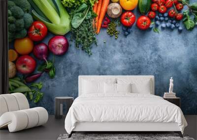 Assortment of fresh fruits and vegetables on a blue background with copy space. Wall mural