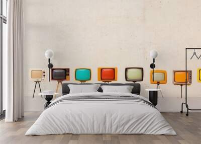 Vintage television sets displayed in a row against a neutral wall. Wall mural