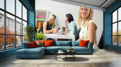 Woman working with computer in the office Wall mural