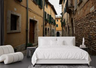 A narrow Italian street with cobblestone paths. Wall mural