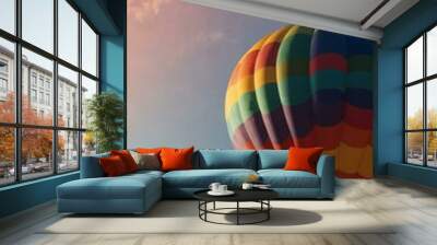 A vibrant hot air balloon floats against a bright backdrop. Wall mural