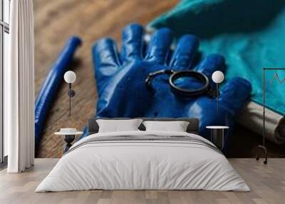 Blue gloves and goggles on a table. Wall mural