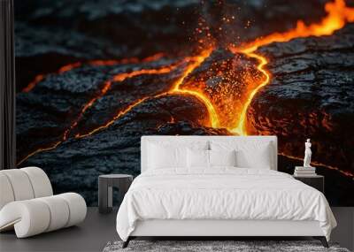 Close-up of molten lava flowing over rocks with sparks flying. Wall mural