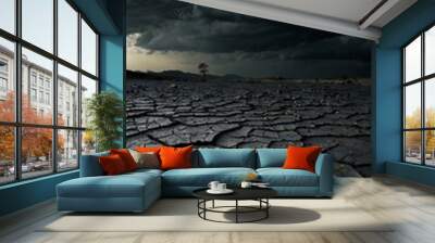 Cracked landscape under a dark sky. Wall mural