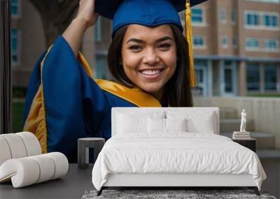 Graduate wearing a cap and gown, celebrating achievement. Wall mural