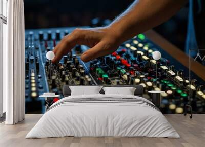 Hands adjusting a sound and light board at a concert. Wall mural