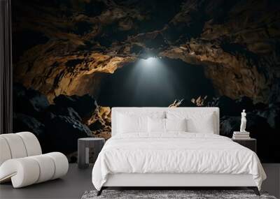 Natural cave in a dark setting. Wall mural