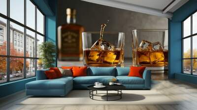 Three glasses of golden whiskey on a light surface. Wall mural