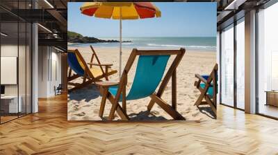 Two beach chairs and umbrellas on a sandy beach Wall mural