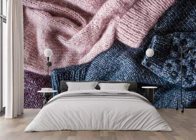 Background from woolen knitted sweaters, flat, top view Wall mural