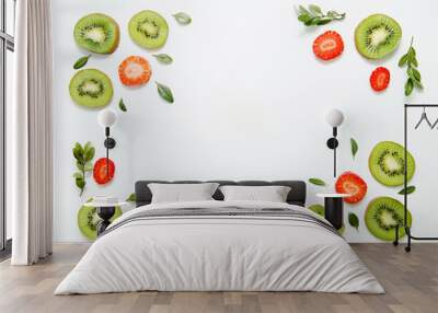 fruit background of kiwi, strawberries and greens. flat lay, top view Wall mural