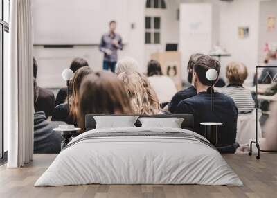 Audience in lecture hall participating at business conference event Wall mural