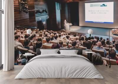 Business speaker giving a talk in conference hall. Wall mural