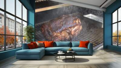 pork shoulder cooking in smoker  Wall mural