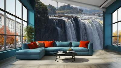 VIctoria falls, one of the seven wonders of the natural world with people at the falls Wall mural