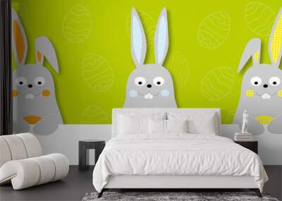 Easter banner with cute cartoon easter bunnies and easter eggs on green background Wall mural