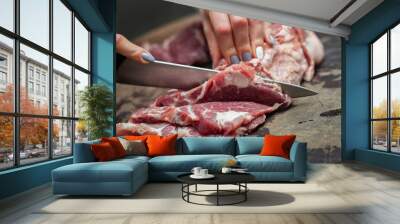 Close shot for slicing and preparing meat with knives, no face Wall mural