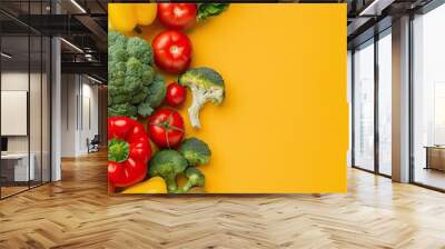 Colorful of fresh vegetables and fruits arranged on a bright yellow background, perfect for healthy eating and organic produce concepts. Wall mural