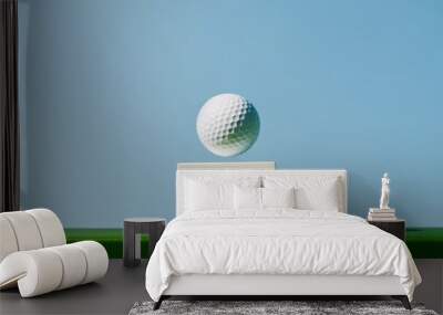 A white cube with a golf ball on top. Golf tournament banner. Wall mural