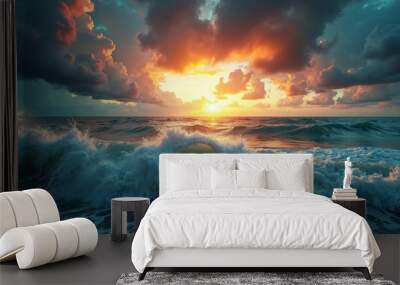 The ocean is rough and the sky is orange and cloudy Wall mural