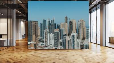 Stunning panoramic view of city skyline with skyscrapers and blue sky Wall mural