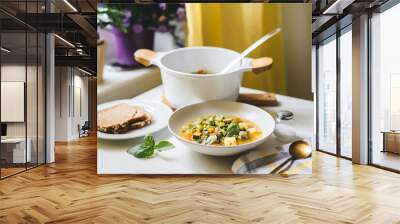 Delicious and healthy traditional italian soup minestrone served in a plate on dining table at the kitchen Wall mural