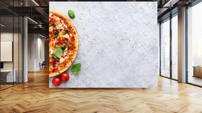 Fresh vegetarian pizza on light blue background Wall mural