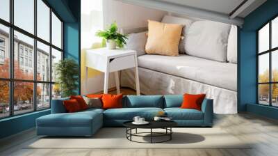 Gray sofa with yellow pillow in living room Wall mural