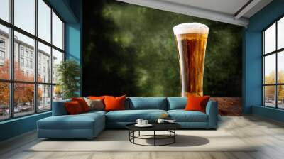 Long glass of beer on dark green background and wooden table with copy space Wall mural