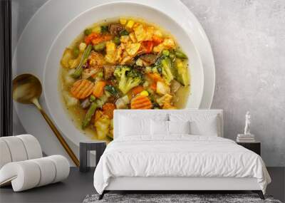 Top view of vegetable soup on light background Wall mural