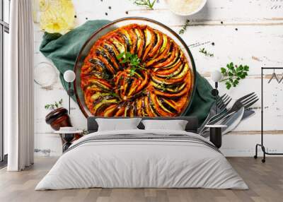 Vegan dish ratatouille made of vegetables in a baking dish on wihte wooden rustic background Wall mural