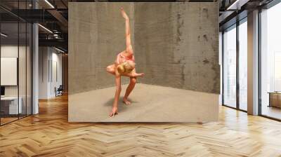 Woman doing yoga on a gray background. Body stretch and concentration . Wall mural