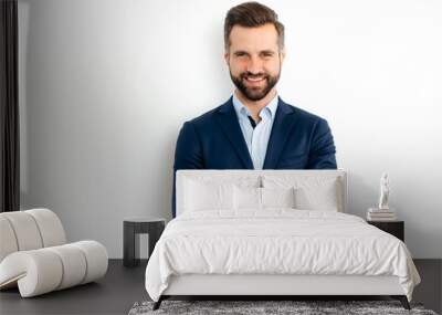 Portrait of a handsome positive caucasian successful bearded business man in a suit, seo, banker, broker, standing over isolated white background with arms crossed, looking at camera, smiling friendly Wall mural