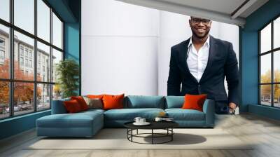 Smiling handsome  african american man in stylish formal suit, outdoors Wall mural