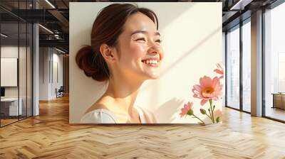 Smiling Woman with flowers on light background with empty space from left Wall mural