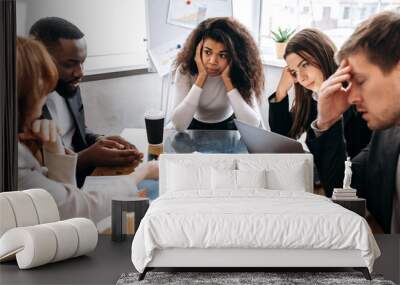 Tired business team are having a briefing meeting, can't find ideas for project. Exhausted male and female employees fail a startup, upset about work troubles, unsuccess and overwork concept Wall mural