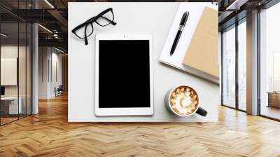 Blank tablet and coffee cup with pen on the desk in office view backgrounds Wall mural