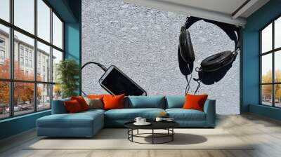 A Pair Of Headphones And A Mobile Phone  Wall mural