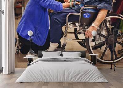 Physical therapist strapping in stroke patient Wall mural