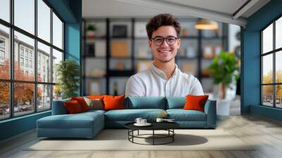 smiling young man in the casual outfit in the office Wall mural