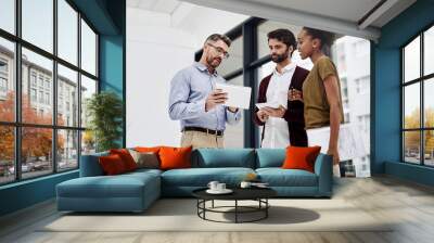 Employee, people and serious at office with tablet for teamwork or collaboration and project. Ideas, discussion and accountant with sharing information or knowledge and feedback on company finance Wall mural