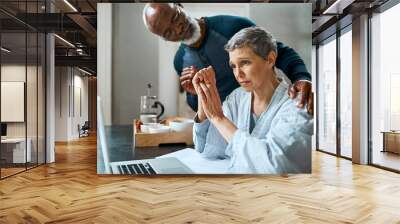 I know its stressful but Im here for you. Shot of a senior married couple stressed out doing their budget at home. Wall mural