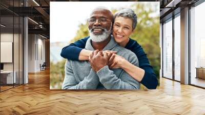 Our love got stronger over the years. Shot of a happy senior couple enjoying quality time at the park. Wall mural